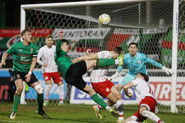 Glentoran’s David Fisher has an attempt on goal against Larne at the Oval. (Photo by INPHO/Jonathan Porter)