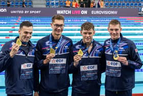 Northern Ireland's Jack McMillan (second left) celebrates gold as part of Great Britain's 4x200m freestyle relay squad across the European Aquatics Championships. Also included are, from left, Matthew Richards, James Guy and Duncan Scott in Paris. (Photo by Benjamin Vodant/Hans Lucas/AFP via Getty Images)
