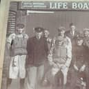 Donaghadee RNLI: Coxswain Andrew White with the crew outside the lifeboat station when it was still known as the boathouse as it did actually house the boarding boat for the lifeboat