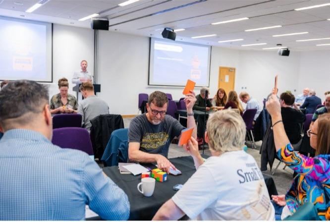 Participants playing a Business Simulation focusing on collaboration