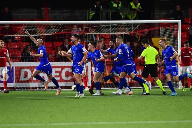 Dungannon Swifts players celebrate after completing their memorable turnaround against Larne at Inver Park
