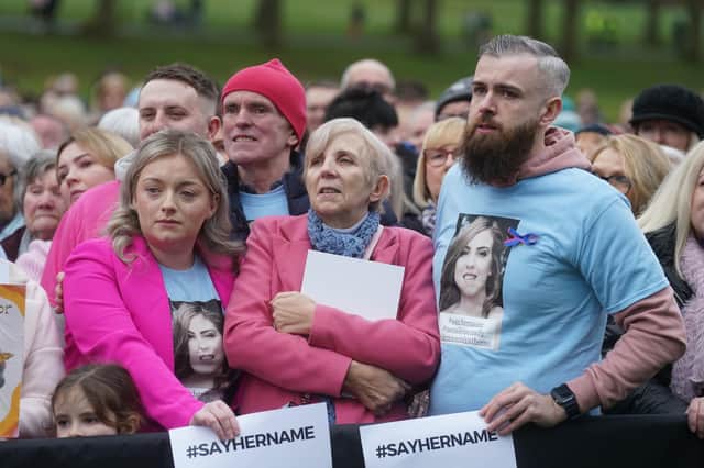 Murder victim Natalie McNally parents, mother Bernie and father Noel, with brother Niall (right) join people at a vigil at Lurgan Park in Lurgan, Co Armagh in memory of their daughter and opposing violence against women.