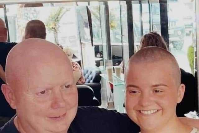 Sophie Cairns with her father Gareth after having her head shaved