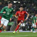 Northern Ireland’s Michael Smith and Switzerland’s Ruben Vargas during their World Cup qualifier at the National Football Stadium at Windsor Park in Belfast. PIC: Colm Lenaghan/Pacemaker