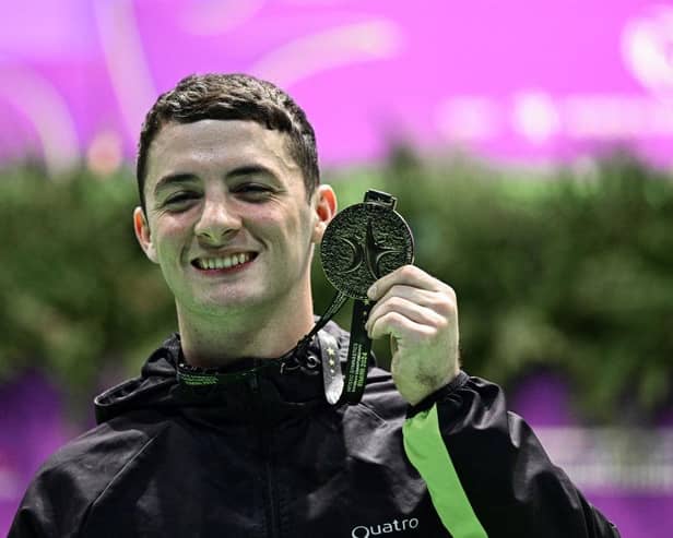 Newtownards' Rhys McClenaghan celebrates on the podium following gold for Ireland in the European Championships pommel horse men's finals. (Photo by GABRIEL BOUYS/AFP via Getty Images)