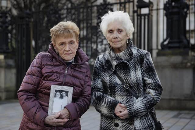 Marie Newton (left), widow of John Toland, and Mary Loughrey, widow of Jim Loughrey, outside the Royal Courts Justice in Belfast after they settled their cases against the Ministry of Defence and PSNI. Liam McBurney/PA Wire