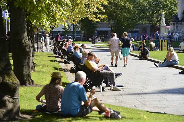 People pictured enjoying the sunshine at Belfast City Hall in Northern Ireland last week.
Picture By: Arthur Allison/Pacemaker Press.