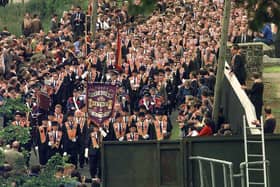 Members of the Orange Order from marching from Drumcree Church towards the barricade blocking their route along the nationalist Garvaghy Road on July 5 1998. Days later three boys would be burned to death in Ballymoney by a petrol bomb thrown through into their house by loyalists