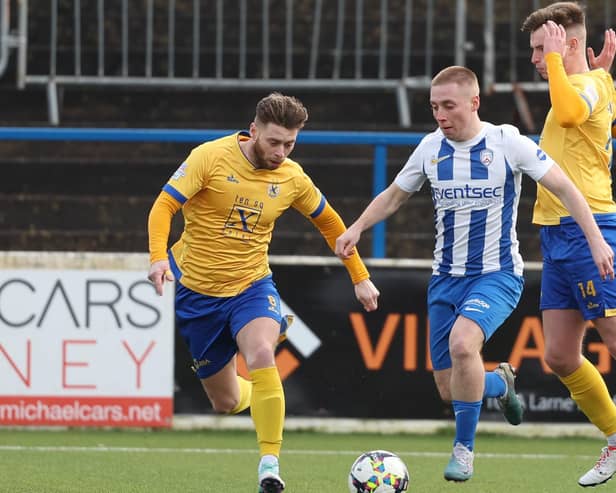 Coleraine winger Conor McKendry is paid close attention by James Knowles and Adam Glenny at The Showgrounds