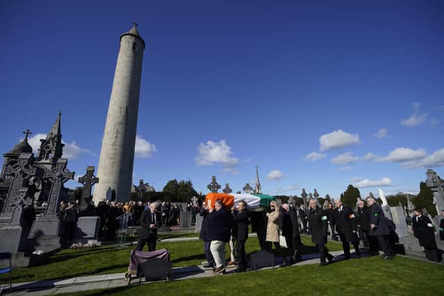 Mourners carry the coffin of former Sinn Fein general secretary Rita O'Hare at Glasnevin Cemetery, Dublin