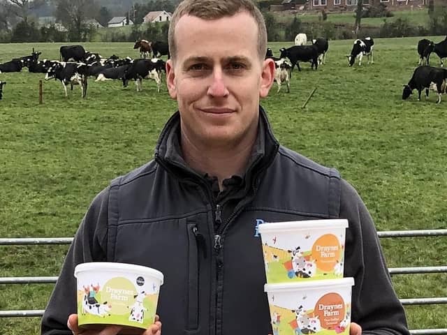 John Drayne runs the luxury ice cream and sorbet business at Draynes Farm, Lisburn. Ice cream is made from fresh milk from the farm’s extensive herd. He is removing some of the old branding to make way for the new