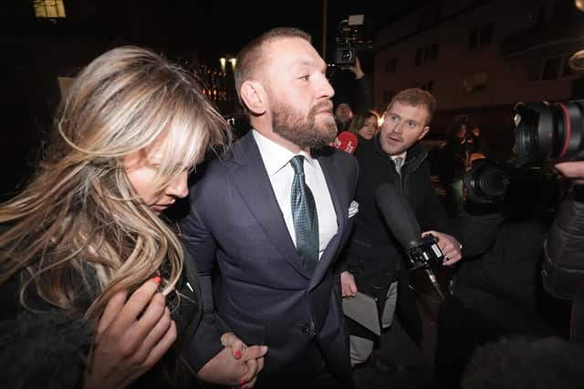 Mixed martial arts fighter Conor McGregor and partner Dee Devlin leave the High Court in Dublin after the personal injury case against him
