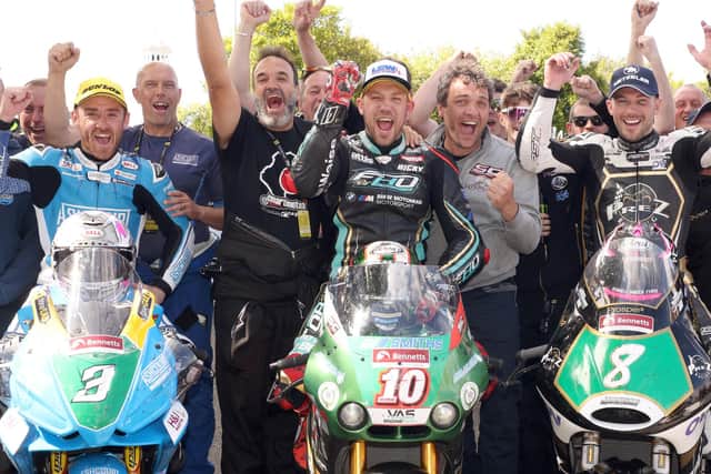 Magherafelt's Paul Jordan (right) celebrates his first rostrum finish at the Isle of Man TT last year in the Supertwin race with winner Peter Hickman and Lee Johnston.