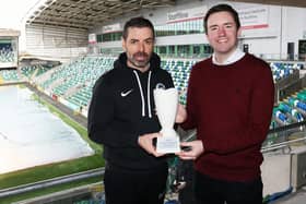 NIFWA Chairman Michael Clarke presents Larne boss Tiernan Lynch with his January Manager of the Month prize