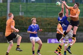 Queen's Charlie Irvine and Buccaneers' Daniel Hawkshaw battling for the All Ireland League advantage on Saturday at The Dub in Belfast. (Photo by Arthur Allison/Pacemaker Press)