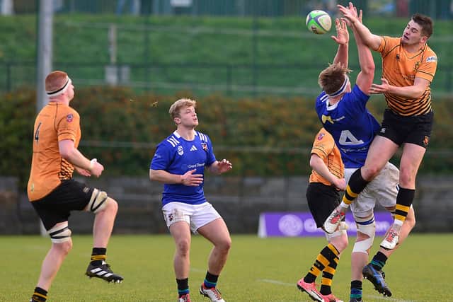 Queen's Charlie Irvine and Buccaneers' Daniel Hawkshaw battling for the All Ireland League advantage on Saturday at The Dub in Belfast. (Photo by Arthur Allison/Pacemaker Press)