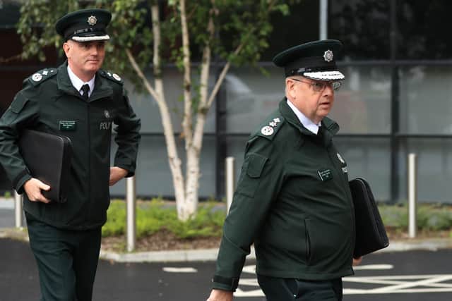 Police Service of Northern Ireland Chief Constable Simon Byrne (right) and Deputy Chief Constable Mark Hamilton arriving at James House in Belfast for a special meeting of the Policing Board. Photo: Liam McBurney/PA Wire
