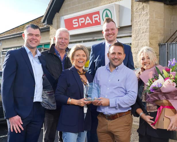 Spar Gortmerron Parade in Dungannon marks 20 years community service. Pictured are store owners James Henderson and Karan Boe with their partners Barbara and Alan, alongside the store’s business development manager, Daren Esler and Justin Hayes, regional sales manager at Henderson Group