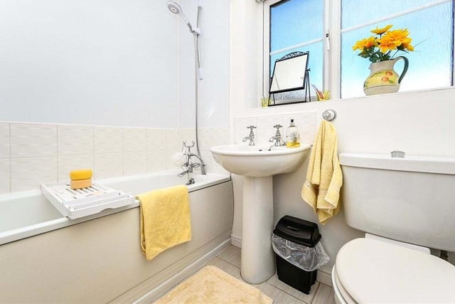 A three-piece suite makes up the family bathroom on the first floor. There is a panelled bath with shower attachment, a pedestal wash hand basin, low-flush WC, tiled splashbacks and a uPVC double-glazed window to the side of the property.