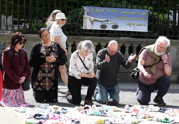 Anti-abortion campaigners placed babies shoes in the shape of 35,000 in front of the High Court on Thursday to highlight the number of abortions on the island of Ireland since it was made legal in Northern Ireland. Pic: Jonathan Porter/PressEye