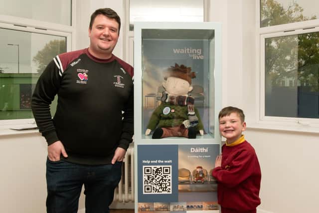 Dáithí Mac Gabhann and his dad Máirtín with Dáithí’s Doll at the Royal Belfast Hospital for Sick Children