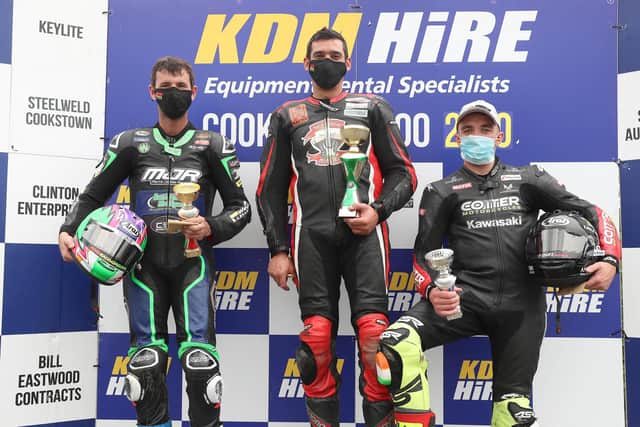 Derek Sheils (Roadhouse BMW) celebrates winning the opening Superbike race at the Cookstown 100 in 2020 with runner-up Michael Sweeney (MJR BMW) and Thomas Maxwell (Kawasaki).