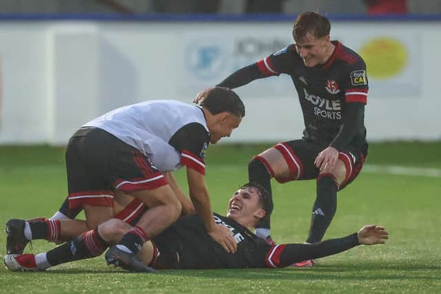 Donal Rocks enjoying the moment with Crusaders team-mates after scoring against Limavady United. (Photo by Desmond Loughery/Pacemaker Press)