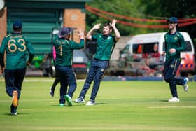 Josh Little high-fiving Paul Stirling after picking up a wicket. PIC: Zimbabwe Cricket