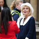 Actor and activist Joanna Lumley, 77, chose a vintage-inspired white hat with a navy ribbon.