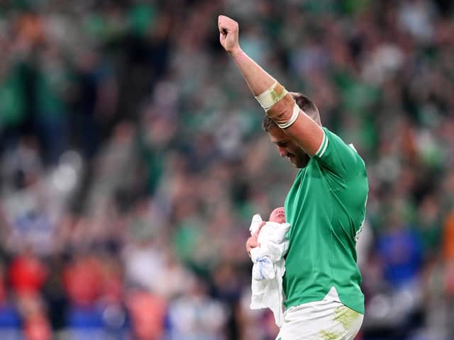 Ireland's Stuart McCloskey celebrates victory with his new-born son Kasper after making his World Cup debut in Saturday's dominant victory over Scotland in Paris