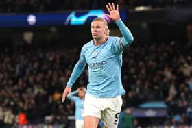 Manchester City's Erling Haaland celebrates his fifth goal last night in the 7-0 victory over RB Leipzig as the striker created Champions League history