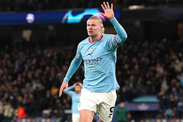 Manchester City's Erling Haaland celebrates his fifth goal last night in the 7-0 victory over RB Leipzig as the striker created Champions League history