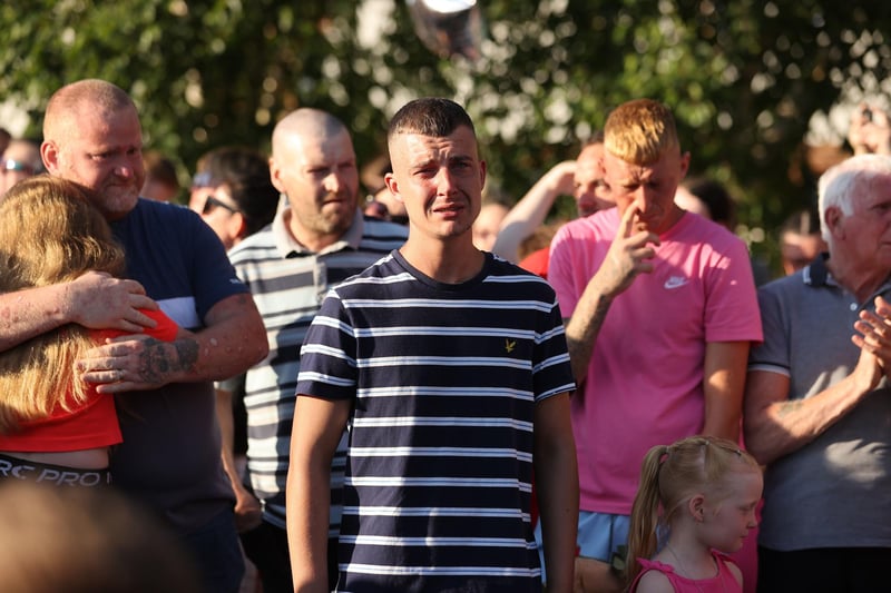 Philip Mitchell, the brother of Chloe Mitchell, shows emotion during a vigil in King George's Park, Ballymena, to mark the death of Chloe Mitchell and violence against women.