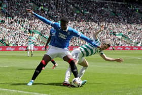 Rangers’ Emmanuel Fernandez (left) battling against Celtic on Sunday. (Photo by Steve Welsh/PA)