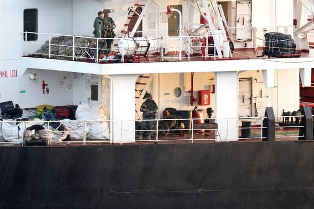Military personnel onboard a cargo vessel named MV Matthew whilst it's escorted into Cobh in Cork by the Irish Navy after a "significant quantity" of suspected drugs were found onboard. Three men have been arrested on suspicion of organised crime offences.  Photo: Niall Carson/PA Wire