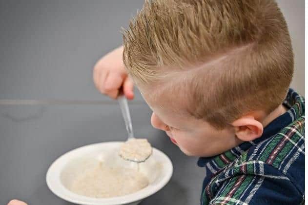Youngster tucks into bowl of porridge