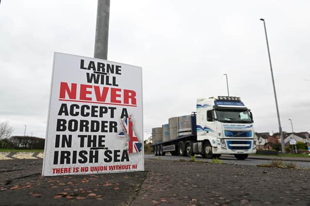A poster protesting against the Northern Ireland protocol is displayed on yesterday in Larne. Larne yesterday. Both the EU and UK will soon operate surveillance on goods as they move though Northern Irish ports (Photo by Charles McQuillan/Getty Images)