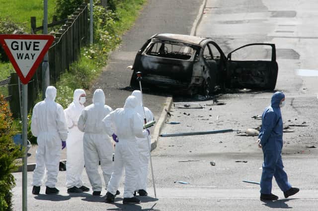 Forensics at the scene of a booby-trap car bomb attack on an off-duty  Catholic policeman in Castlederg. Photo: Pacemaker