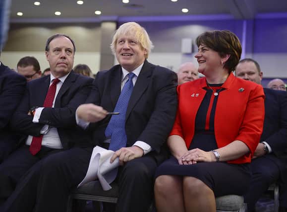 Boris Johnson with Nigel Dodds and Arlene Foster at the 2018 DUP conference where he said he would oppose an Irish Sea border. But Mr Johnson’s later NI Protocol Bill added to the recent pressure exerted on the EU by the DUP. Picture: Arthur Allison/Pacemaker Press