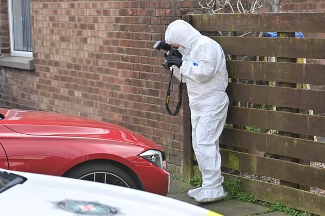 A forensics officer yesterday at the scene of Sunday night’s attack on a house in Newtownards  Pic Colm Lenaghan/Pacemaker
