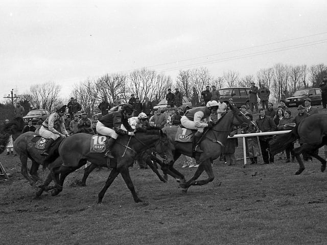 Pictured at the Harp National in Downpatrick in February 1992 is Lacken Beau (No 1), second in the national, who is seen battling it out with Wee Madge (No 10) which finished third. The star of the national was Desert Orchid. The News Letter reported that he “strutted, proud and tall, around the race track to loud and eager applause, looking every bit the champion”. Fans had turned out to get a close look at the grey who had retired from racing two years previously. Picture: News Letter archives