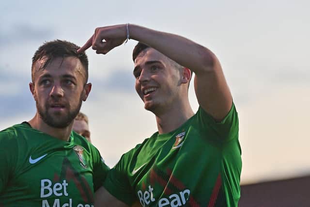 Conor McMenamin (left) and Jay Donnelly enjoying the 5-0 victory for Glentoran over Glenavon.