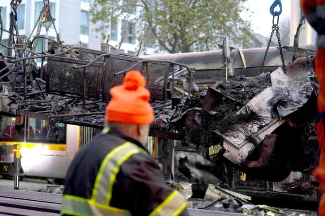 A burned out bus is removed from O'Connell Street  in Dublin, in the aftermath of violent scenes in the city centre on Thursday evening. The unrest came after an attack on Parnell Square East where five people were injured, including three young children