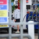 A customer re-fuels his cars at a petrol station as diesel brushes close to £2 per litre in Northern Ireland (photo by Leon Neal/Getty Images)