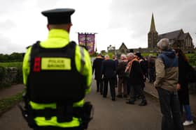Orangemen turn away from a police barricade close to Drumcree Church formed to prevent them entering the Garvaghy Road. Pic: Brian Lawless/PA Wire