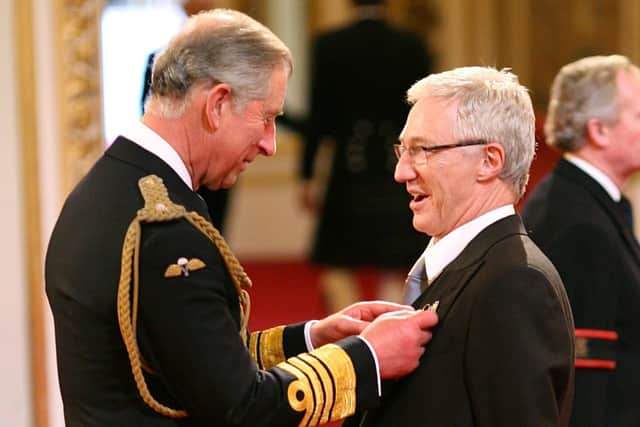 File photo dated 16/10/08 of Paul O'Grady  being made a Member of the Order of the British Empire by the then Prince of Wales (now King Charles III), at Buckingham Palace