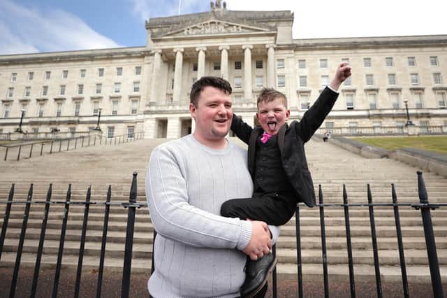 Mairtin Mac Gabhann, with his six-year-old son Daithi Mac Gabhann, who is set to be named Ulster University Postgraduate Student of the Year. Photo: Liam McBurney/PA Wire