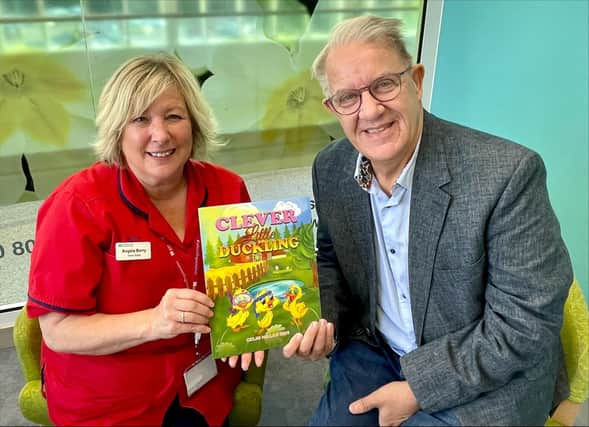 Angela Berry, ward manager, Ulster Hospital, and Colin Millar, MBE, who has written the children's book, Clever Little Duckling