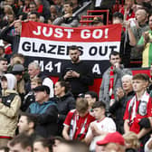 Manchester United fans hold up a banner of protest against the Glazers during a Premier League match at Old Trafford in September 2023. (Photo by Richard Sellers/PA Wire)