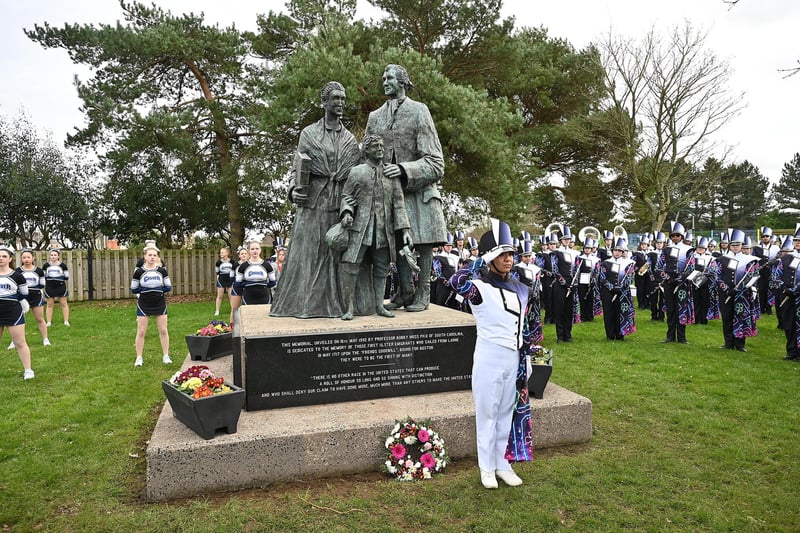 Clover High School Band holds a short wreath laying ceremony at Larne war memorial to commemorate American soldiers who trained in the area during the Second World War